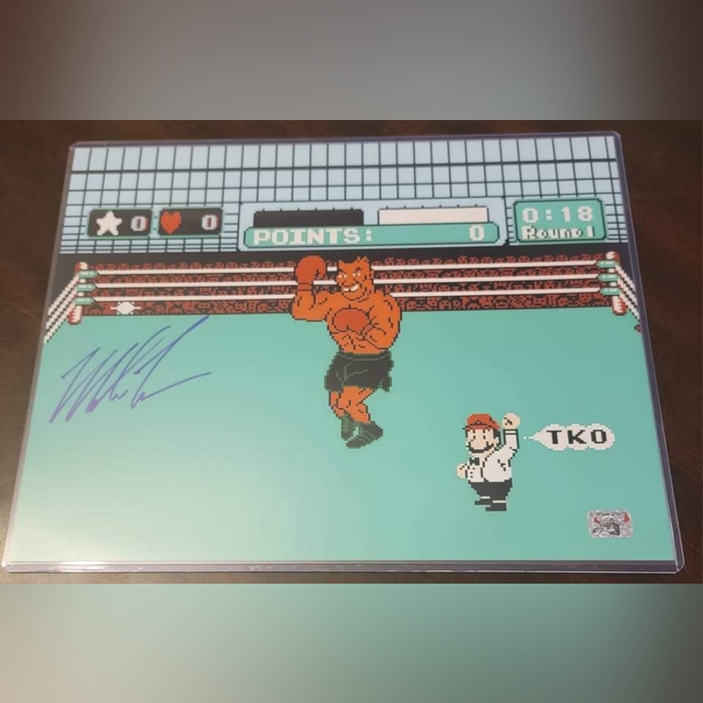 Mike Tyson signed Punch Out 11x14 photo.